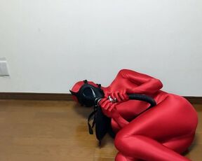 Respiratory control with gas mask on red zentai