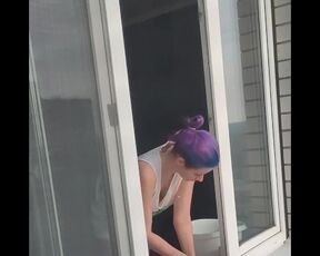 A neighbor girl washes windows without a bra and panties